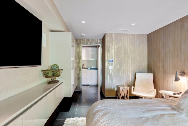 bedroom featuring dark tile patterned flooring