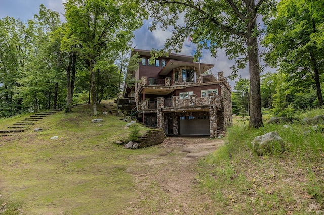 rear view of property with a wooden deck