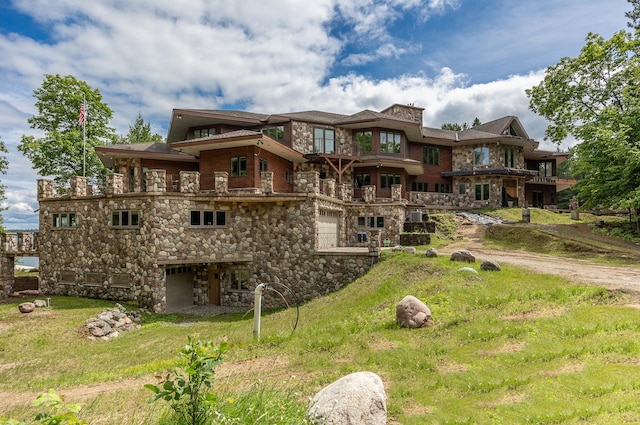 rear view of property featuring a yard