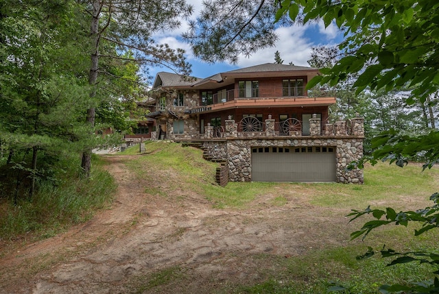 back of house featuring a garage