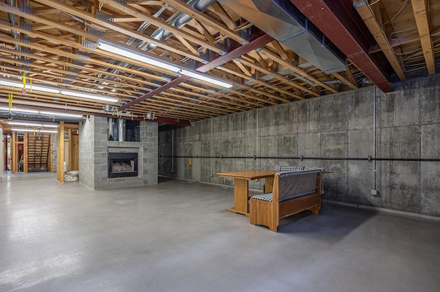 basement featuring a large fireplace