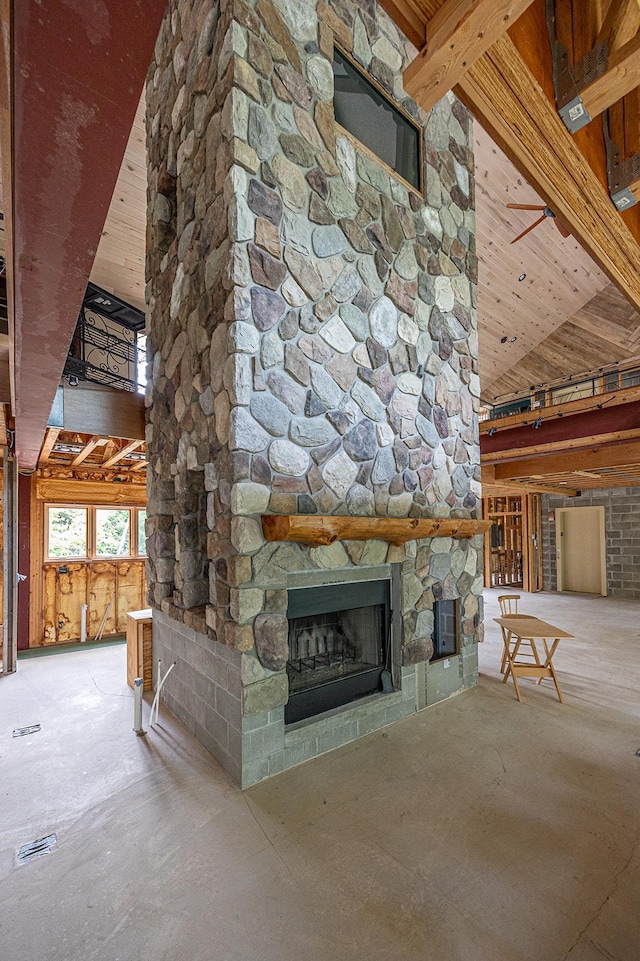 unfurnished living room featuring a high ceiling and a fireplace