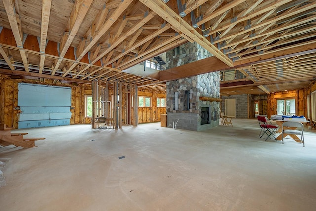 miscellaneous room featuring a fireplace and a wealth of natural light