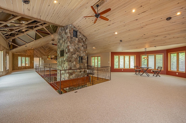 unfurnished living room featuring high vaulted ceiling, ceiling fan, wooden ceiling, and carpet floors