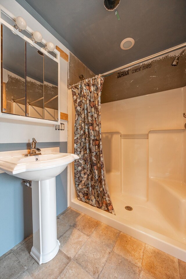 bathroom with a shower with curtain