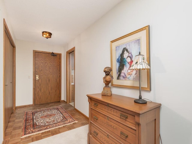 entryway featuring baseboards