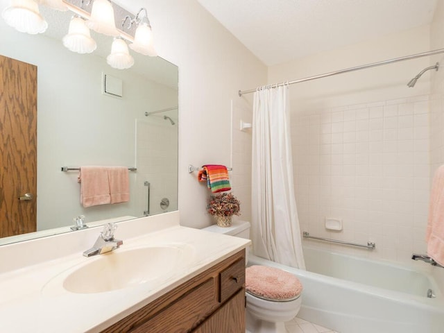 full bathroom featuring vanity, shower / bath combo with shower curtain, toilet, and tile patterned floors