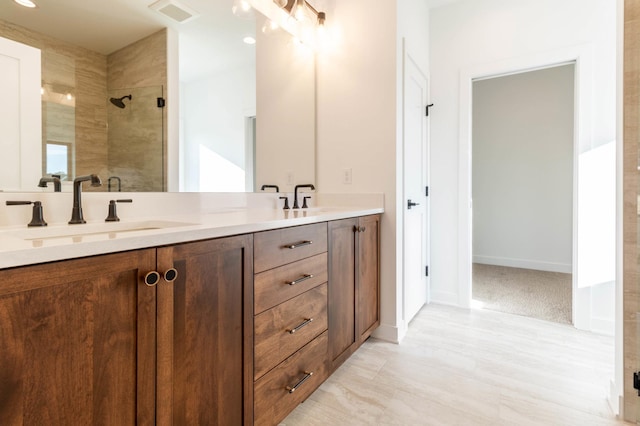 bathroom featuring vanity and walk in shower