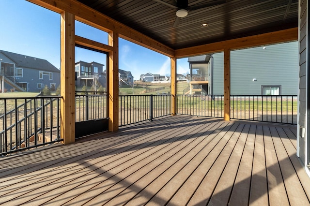 wooden terrace featuring ceiling fan