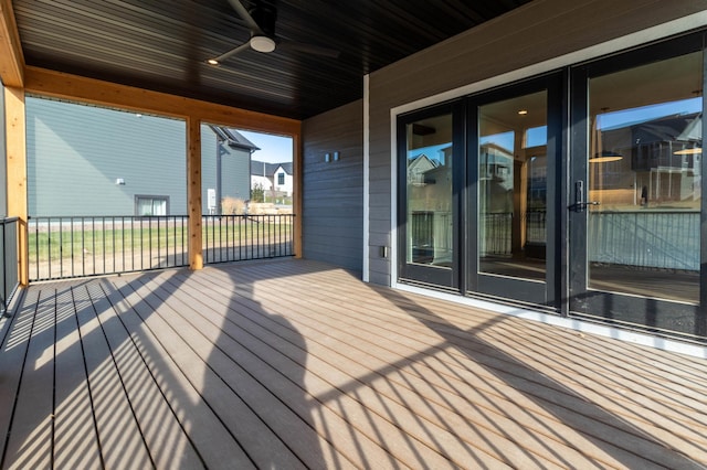 wooden terrace featuring ceiling fan