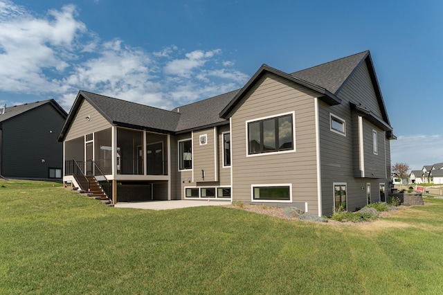 3180 Bella Terra Ln NE, Rochester, MN 55906 - back of property with a sunroom, a patio area, a yard, and a shingled roof