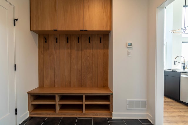 mudroom featuring hardwood / wood-style floors and sink