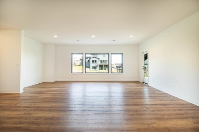 empty room featuring dark wood-type flooring