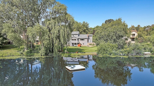 dock area featuring a water view and a yard