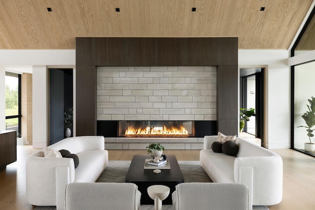 living room with hardwood / wood-style floors, wood ceiling, and vaulted ceiling