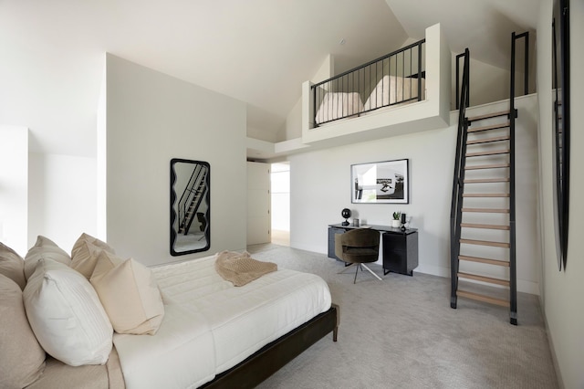 bedroom with light carpet and high vaulted ceiling