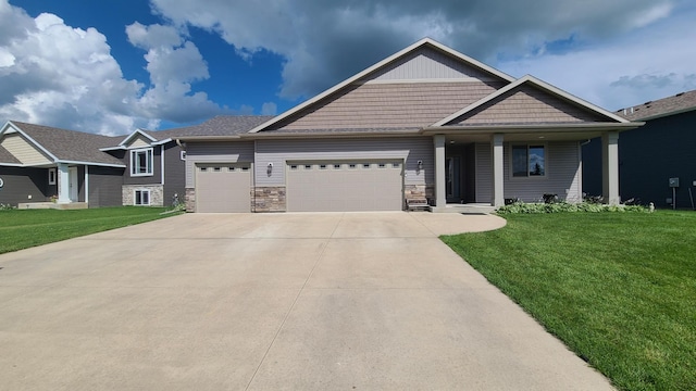 craftsman-style home with a garage and a front yard