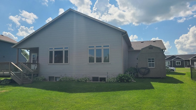 back of house featuring a yard