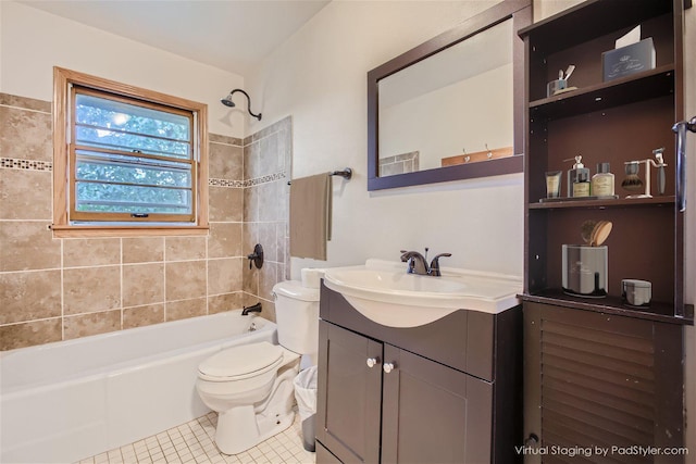 full bathroom with tile patterned floors, toilet, vanity, and tiled shower / bath