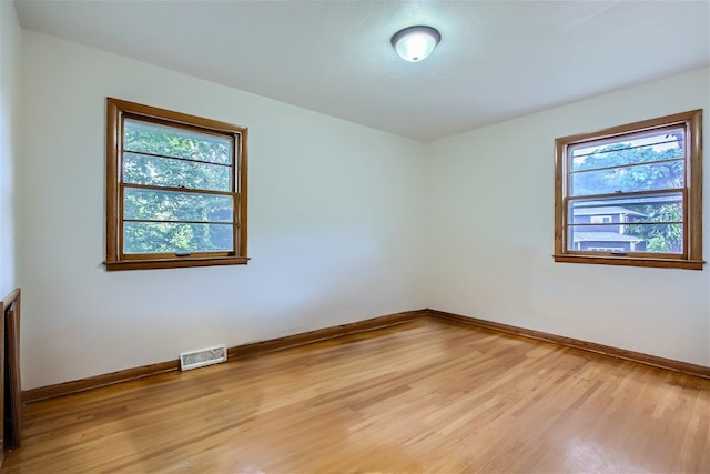 spare room featuring light hardwood / wood-style flooring