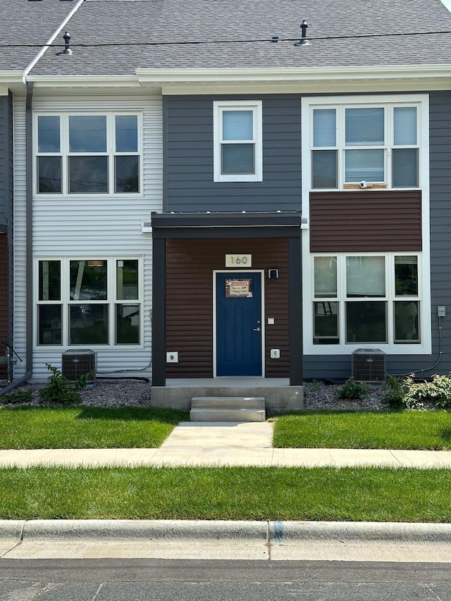 view of front of house featuring cooling unit