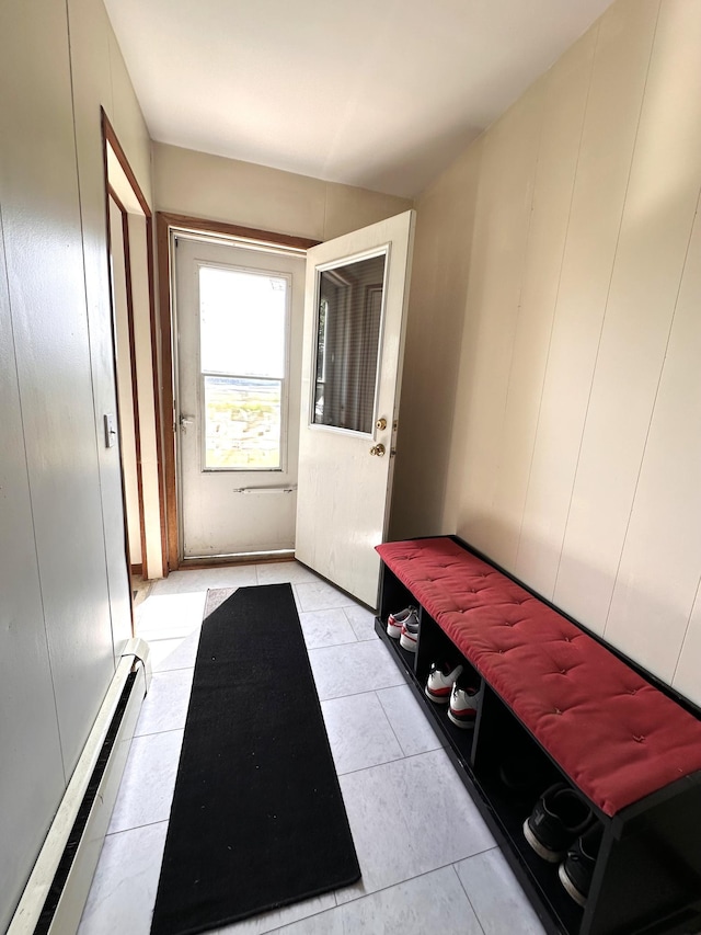 mudroom with baseboard heating and light tile patterned flooring