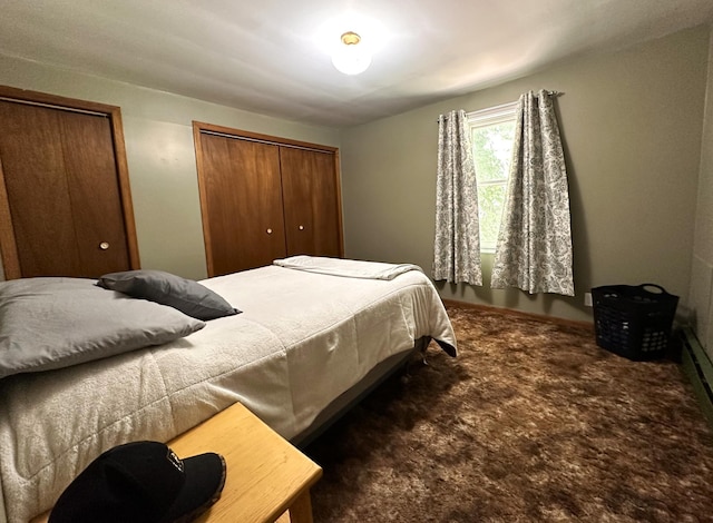 bedroom featuring two closets and carpet flooring