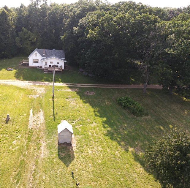 drone / aerial view featuring a rural view and a forest view