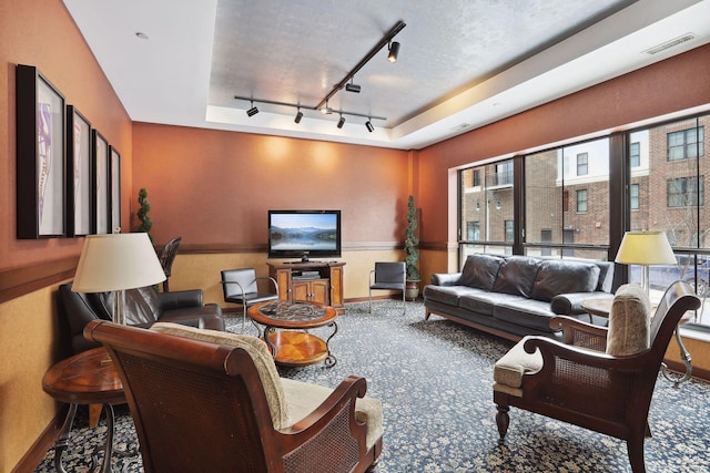 living area featuring a wainscoted wall and visible vents