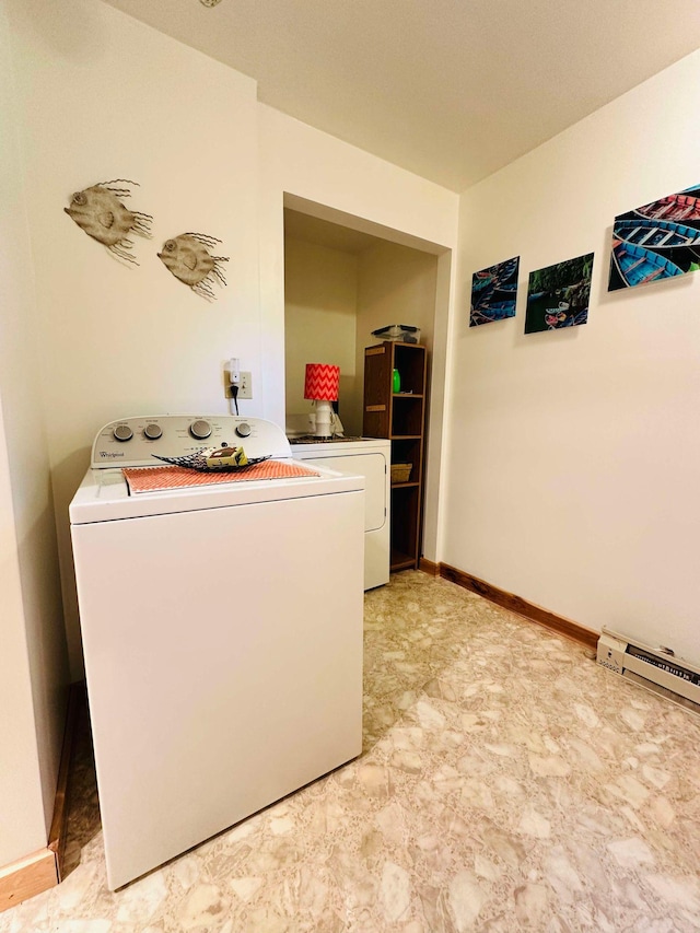 washroom with washer and clothes dryer and light tile patterned floors