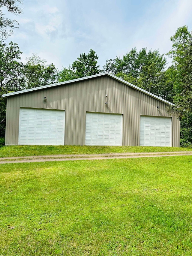 garage featuring a yard