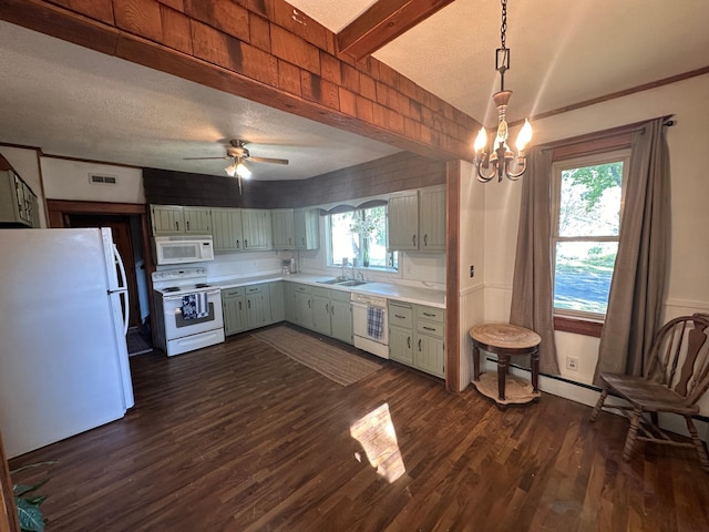 kitchen featuring white appliances, dark wood-type flooring, a sink, visible vents, and light countertops