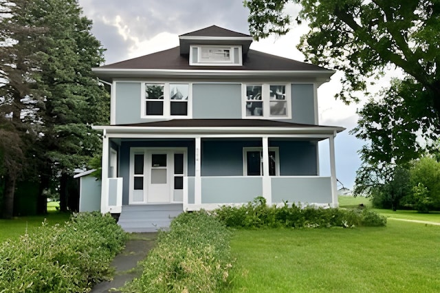 view of front of property with a front lawn