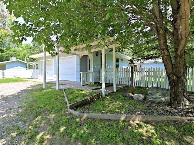 view of front of home with a porch and a garage