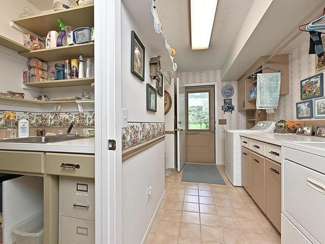 20761 Moose Point Rd, Grand Rapids, MN 55744 - clothes washing area with laundry area, light tile patterned floors, a textured ceiling, and a sink