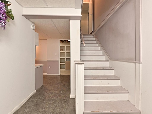 20761 Moose Point Rd, Grand Rapids, MN 55744 - stairs with a paneled ceiling and baseboards