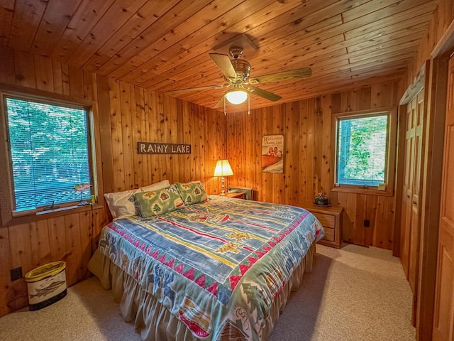 bedroom featuring wood ceiling, carpet floors, and ceiling fan