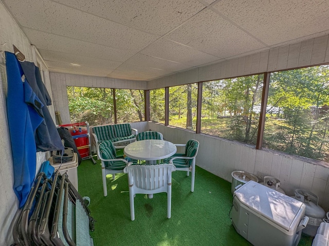 unfurnished sunroom with a paneled ceiling