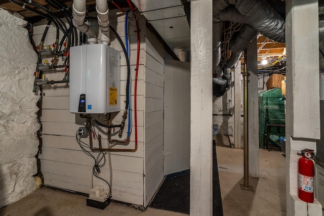 utility room featuring water heater