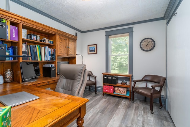 office with hardwood / wood-style floors, crown molding, and a textured ceiling