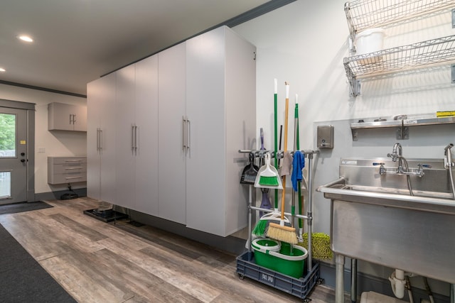 kitchen with white cabinets and hardwood / wood-style flooring