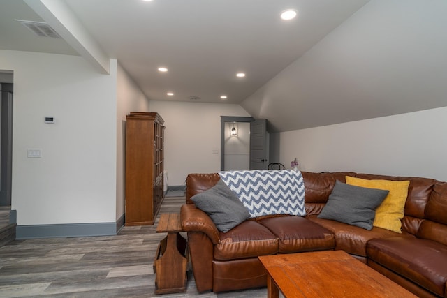 living room with hardwood / wood-style flooring and lofted ceiling