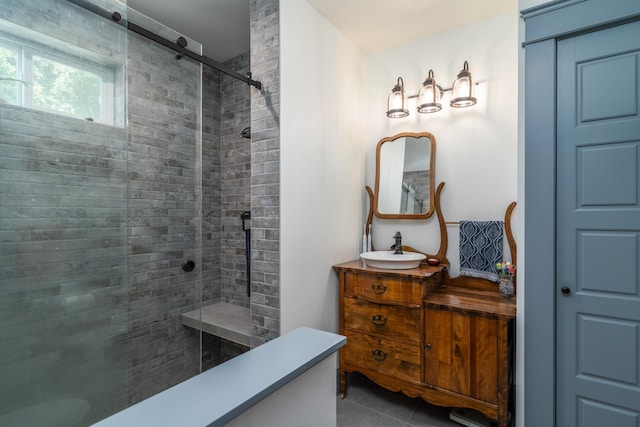 bathroom featuring vanity, tile patterned floors, and walk in shower