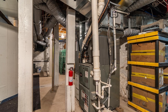 utility room with heating unit