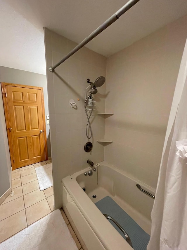 bathroom with tile patterned flooring and shower / bath combo with shower curtain