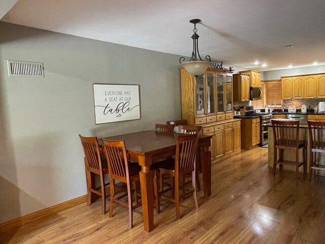 675 10th St, Granite Falls, MN 56241 - dining space featuring light wood finished floors and recessed lighting