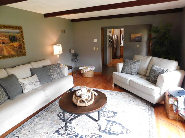 675 10th St, Granite Falls, MN 56241 - living area featuring wood finished floors and beam ceiling
