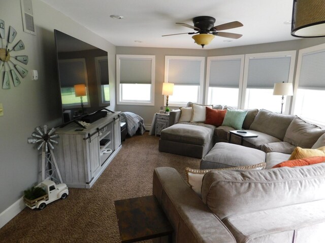 675 10th St, Granite Falls, MN 56241 - carpeted living area featuring ceiling fan and baseboards