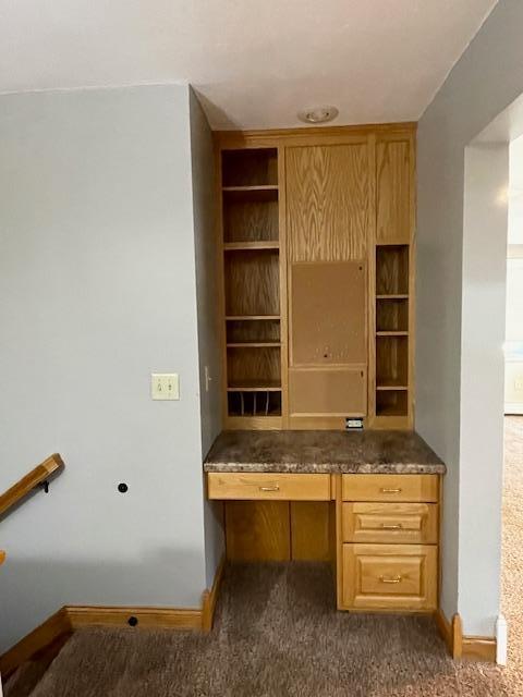 675 10th St, Granite Falls, MN 56241 - unfurnished office featuring built in desk and dark colored carpet