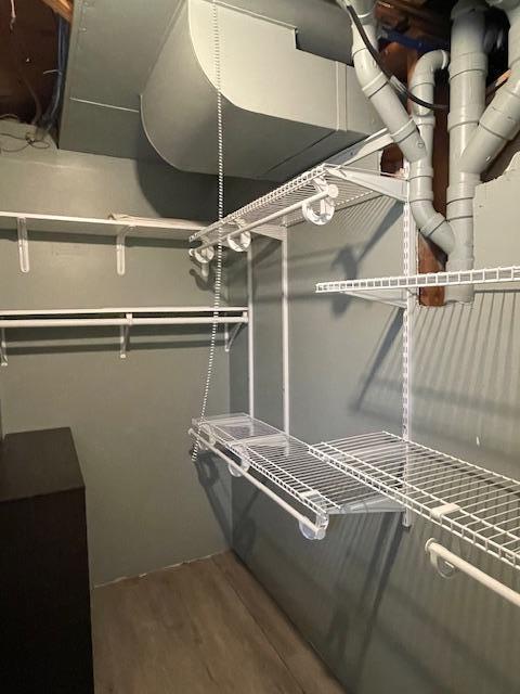 675 10th St, Granite Falls, MN 56241 - walk in closet featuring wood finished floors